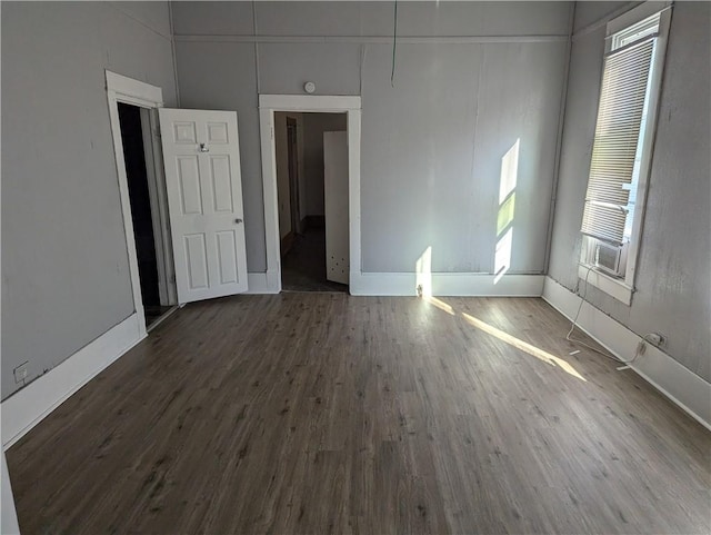 empty room featuring dark hardwood / wood-style floors