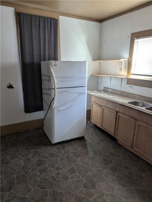 kitchen with white fridge and sink