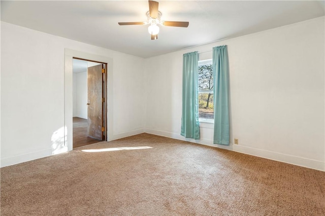 empty room with carpet floors and ceiling fan