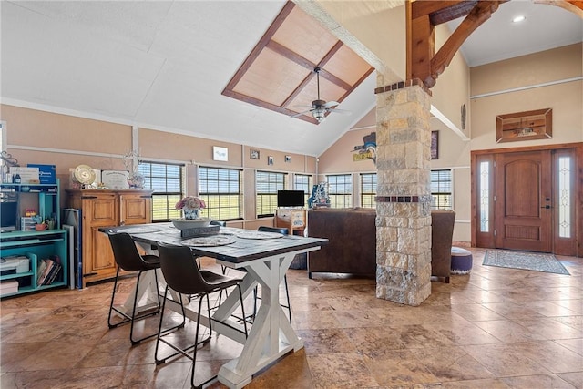 dining space with ceiling fan, ornamental molding, and high vaulted ceiling