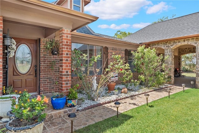 property entrance featuring a yard