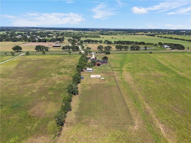 birds eye view of property with a rural view