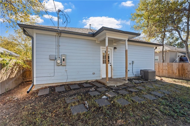 back of house with cooling unit