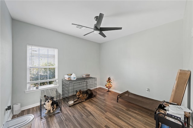 misc room with ceiling fan and dark hardwood / wood-style flooring