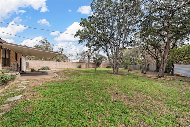 view of yard featuring a patio area and fence