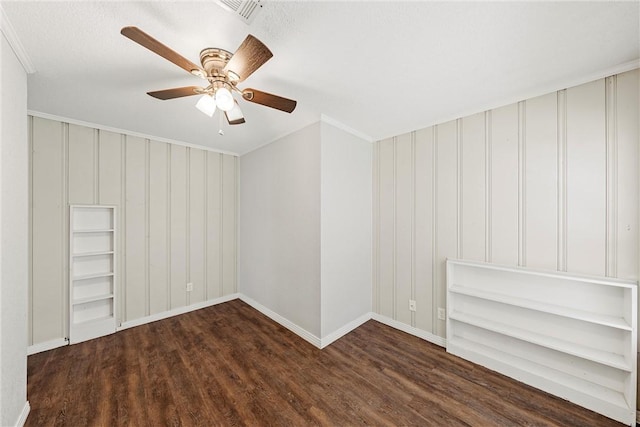 unfurnished room with ceiling fan, crown molding, visible vents, and wood finished floors