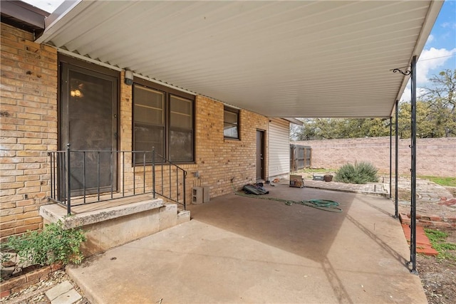 view of patio featuring a carport