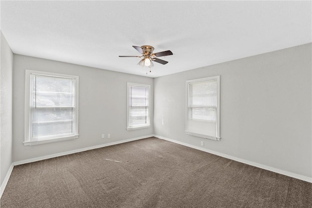 empty room featuring carpet, ceiling fan, and baseboards