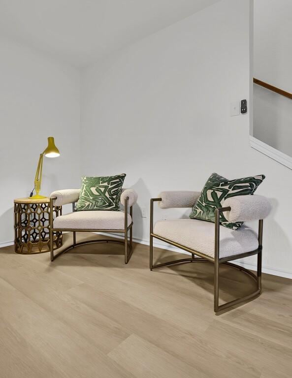 sitting room with light wood-style flooring and baseboards