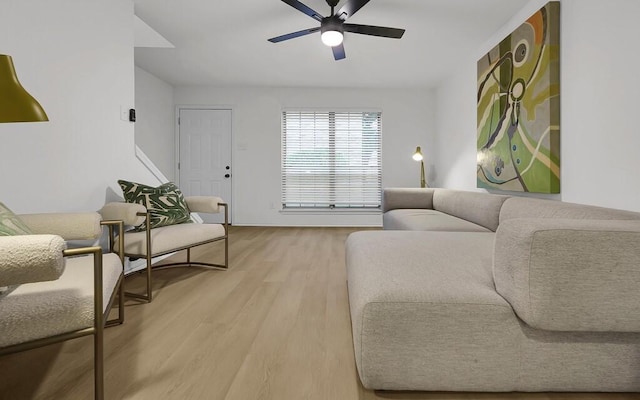 living area with ceiling fan and light wood-style floors