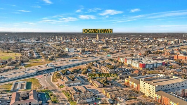 birds eye view of property with a city view