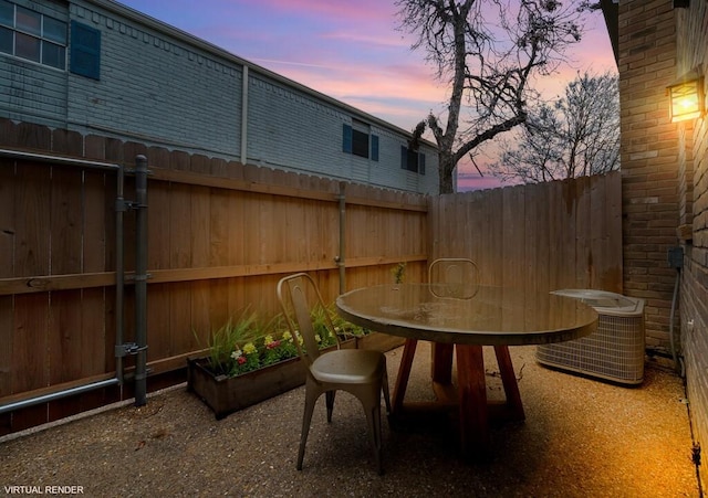 view of patio with cooling unit and fence