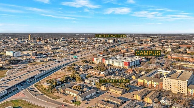 birds eye view of property with a city view