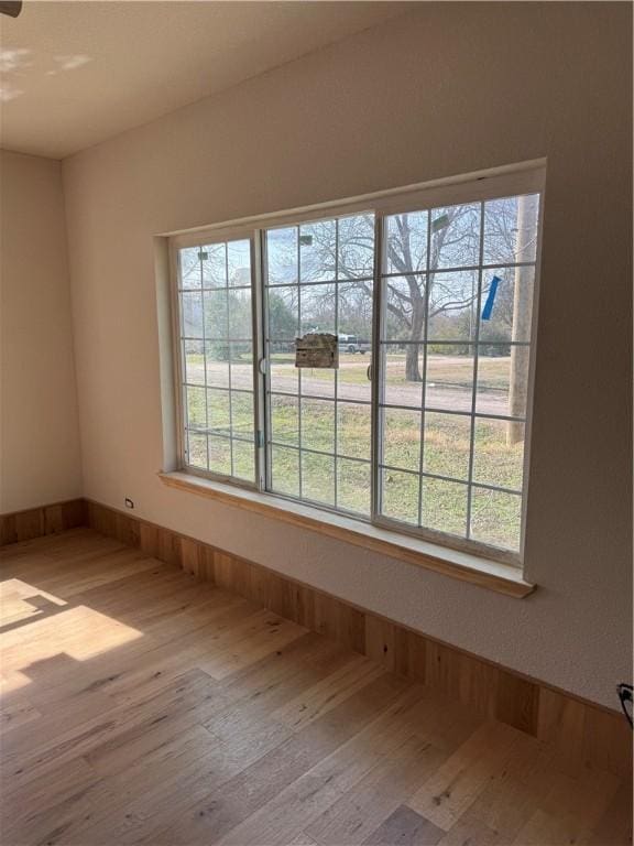 unfurnished room featuring light hardwood / wood-style floors