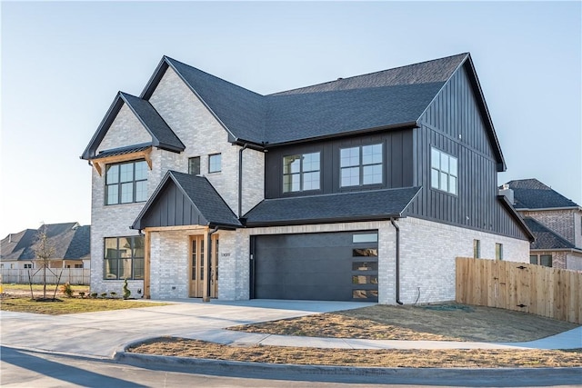 modern inspired farmhouse with a garage