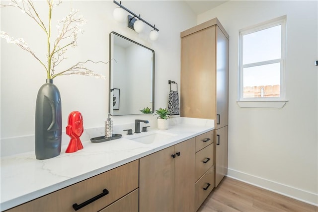 bathroom with vanity and hardwood / wood-style flooring