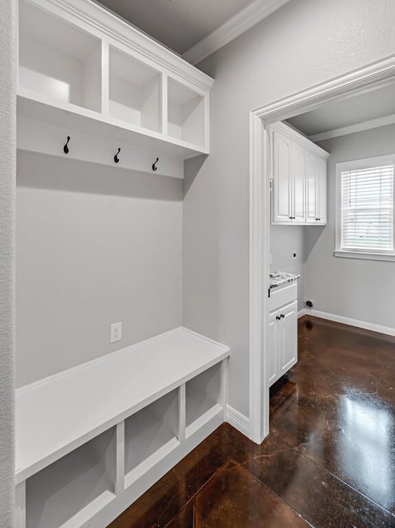 mudroom featuring crown molding