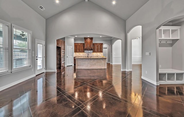 living room featuring high vaulted ceiling