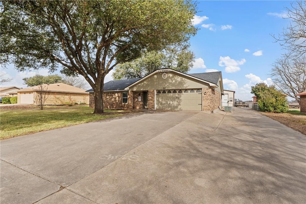 single story home with a front lawn and a garage