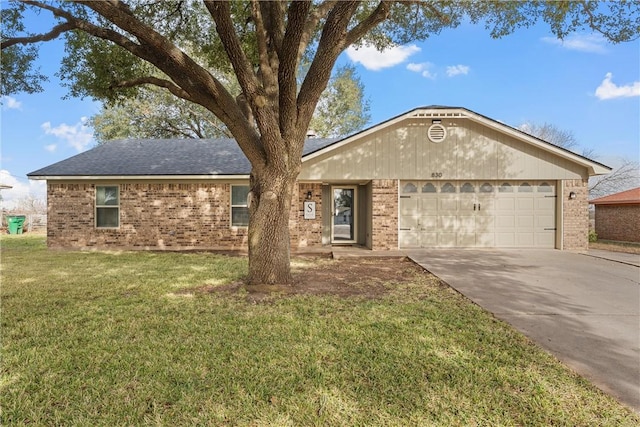 ranch-style home featuring a front yard and a garage