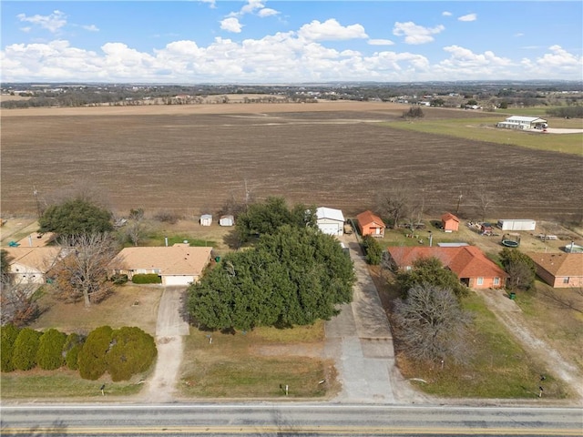 birds eye view of property featuring a rural view