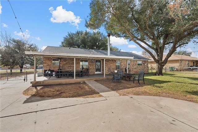 back of house featuring a yard