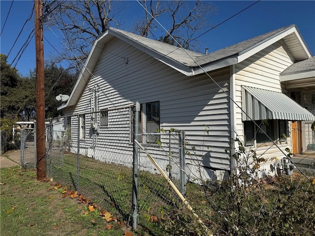 view of home's exterior with a lawn