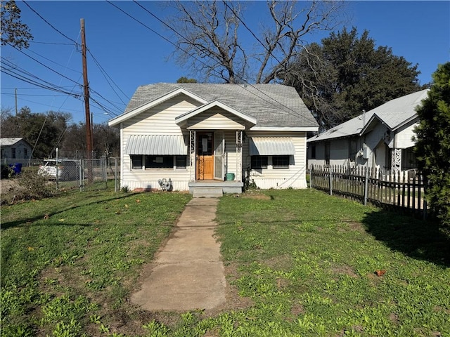 bungalow-style home with a front lawn