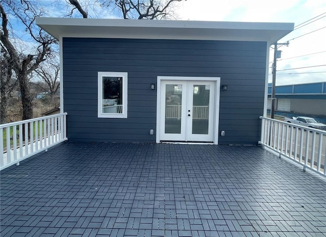 rear view of property featuring french doors