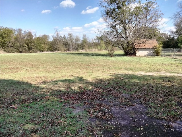 view of yard with a rural view