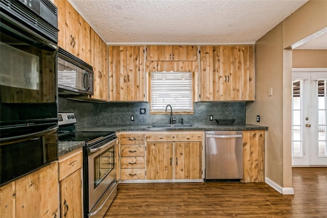 kitchen featuring backsplash, dark hardwood / wood-style flooring, french doors, and black appliances