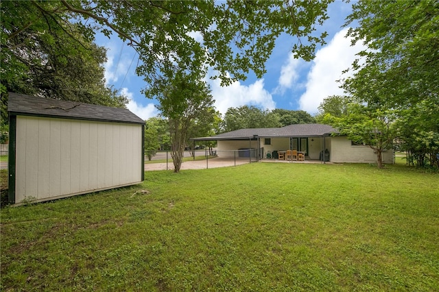 view of yard featuring a patio and a shed