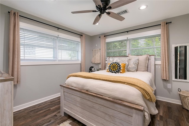 bedroom with ceiling fan and dark wood-type flooring