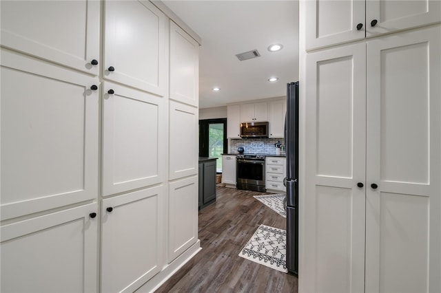 hall with dark hardwood / wood-style floors