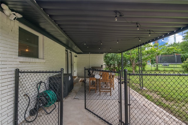 view of patio / terrace featuring a trampoline and grilling area