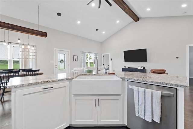 kitchen with dishwasher, high vaulted ceiling, white cabinets, sink, and decorative light fixtures