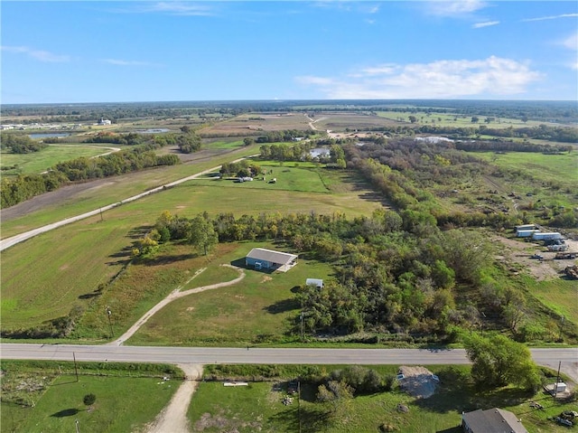 birds eye view of property with a rural view