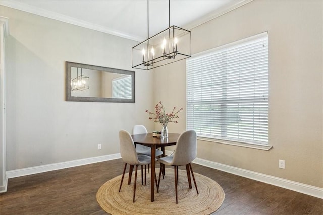 dining room featuring dark hardwood / wood-style flooring and crown molding