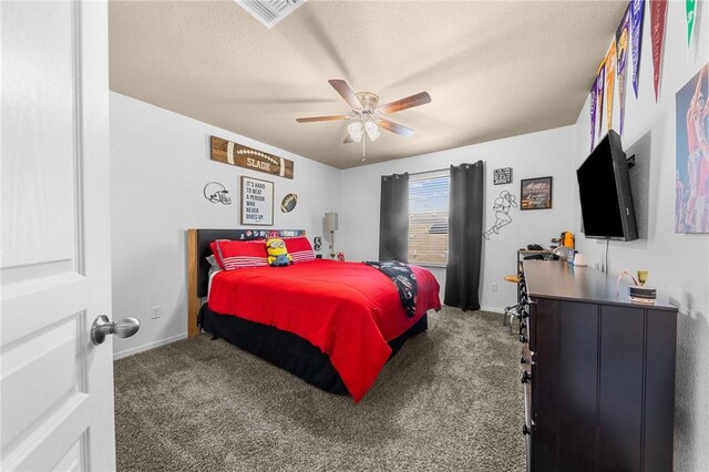 carpeted bedroom featuring baseboards, visible vents, ceiling fan, and a textured ceiling