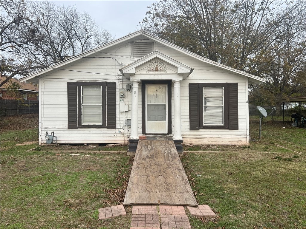 bungalow with a front lawn