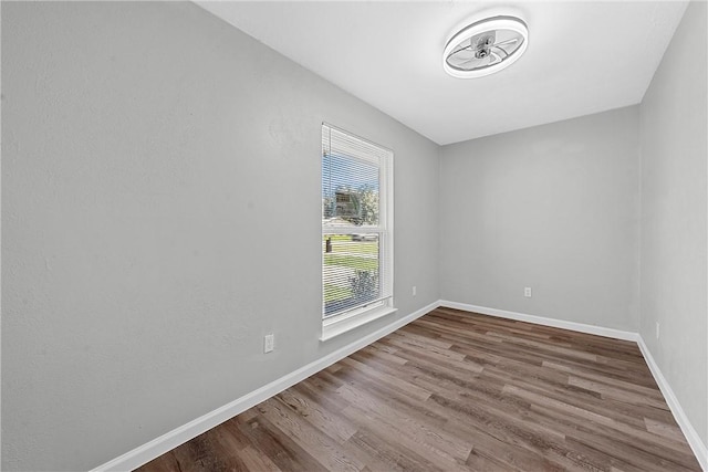 unfurnished room featuring hardwood / wood-style floors