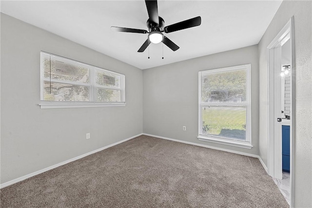 unfurnished room featuring light carpet and ceiling fan