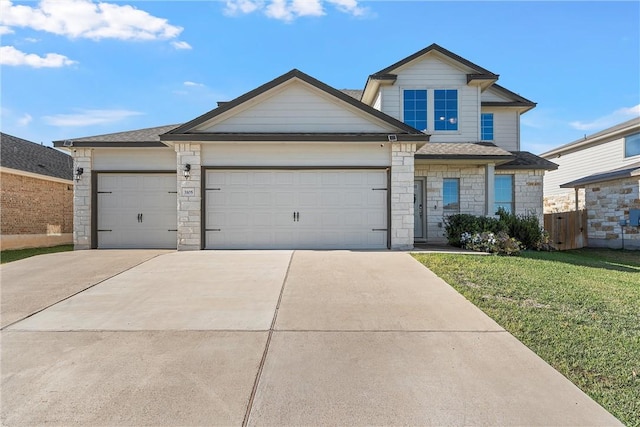 view of front facade with a garage and a front yard