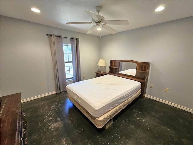 bedroom with recessed lighting, concrete floors, and baseboards