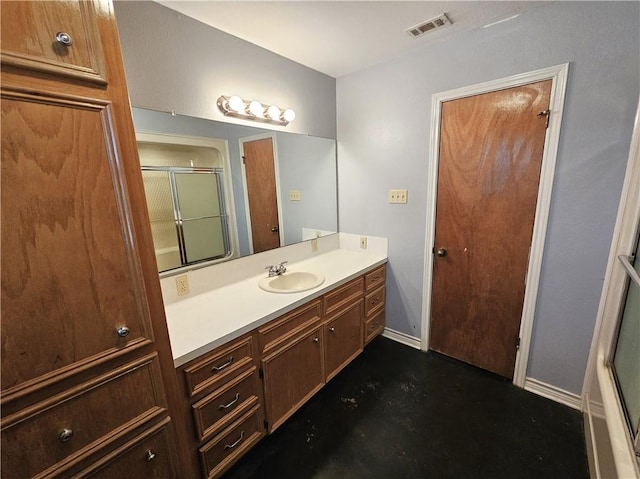 bathroom featuring visible vents, vanity, finished concrete floors, and a shower with shower door