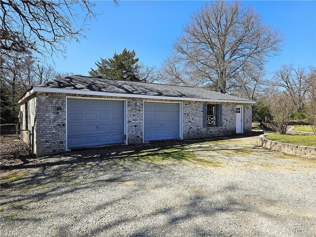 garage with fence