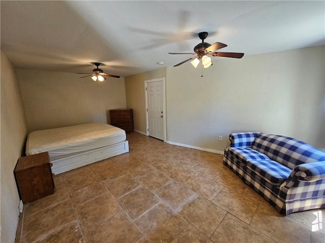 bedroom featuring ceiling fan and baseboards