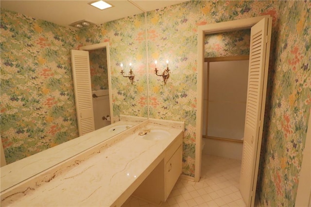 bathroom with tile patterned floors, vanity, and toilet