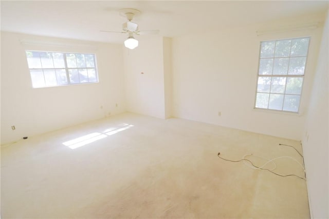 carpeted empty room with ceiling fan