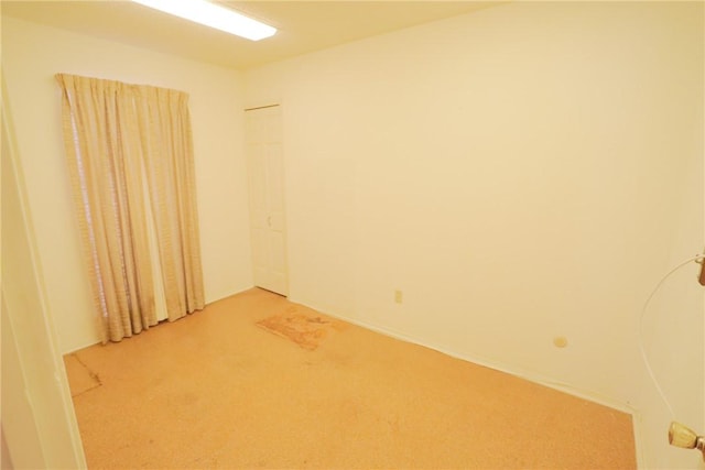 empty room featuring carpet floors